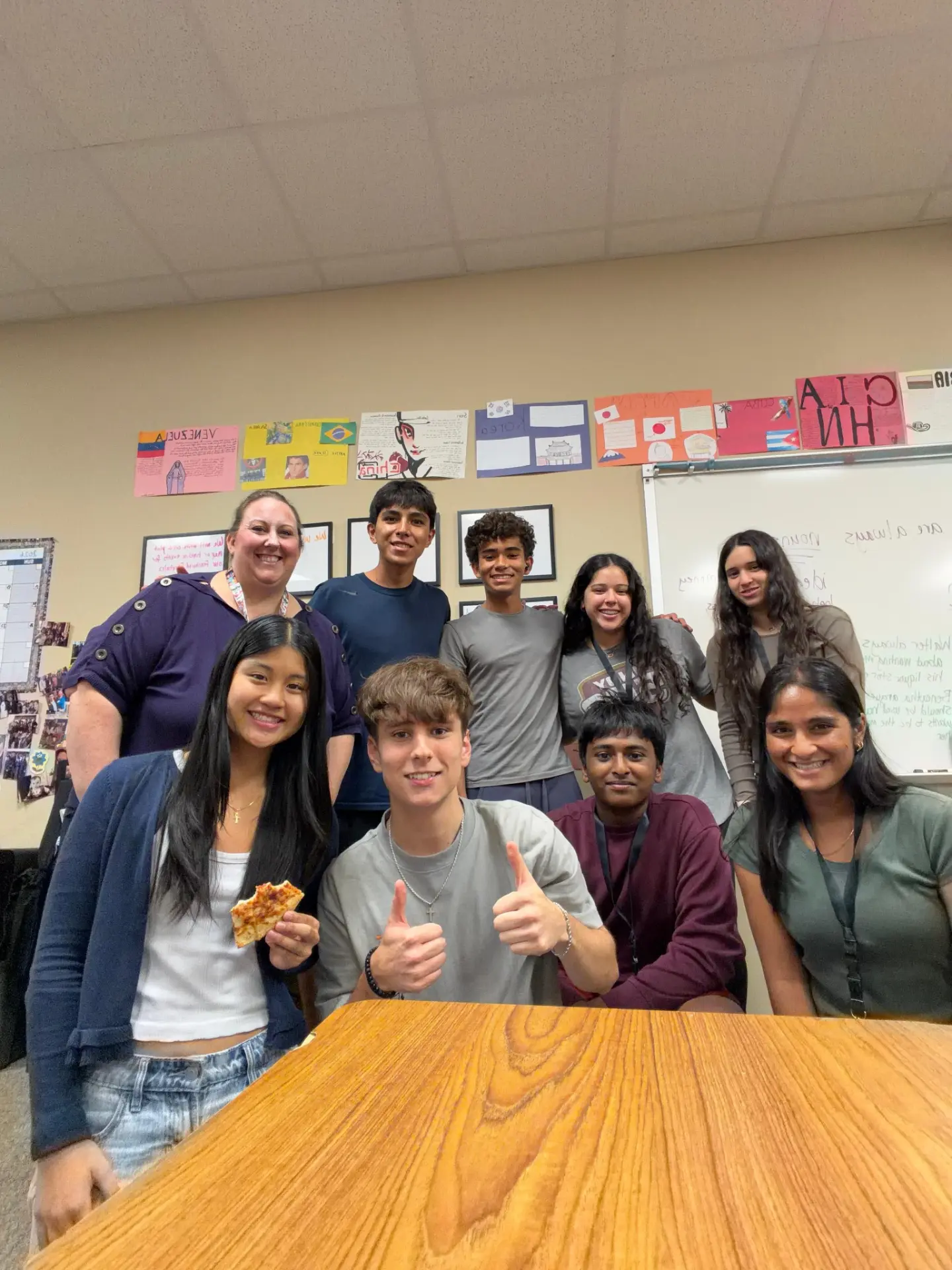 Together We Grow & ESL Connect club members with two educators in a classroom